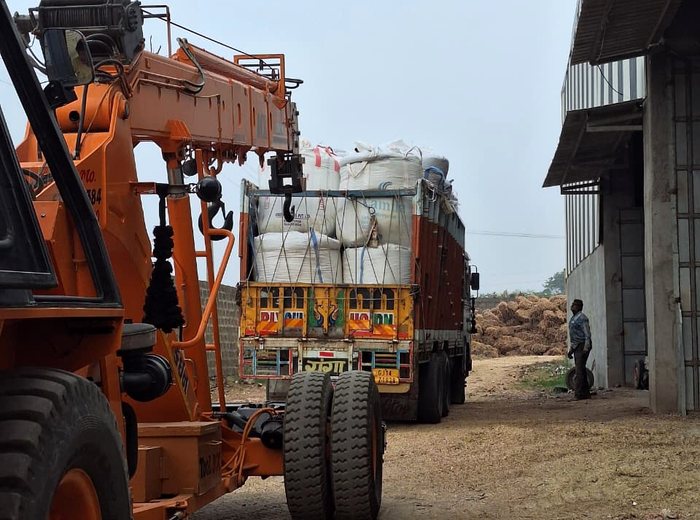 Bagged biomass craned onto a truck at the Junagadh plant for pan-India dispatch