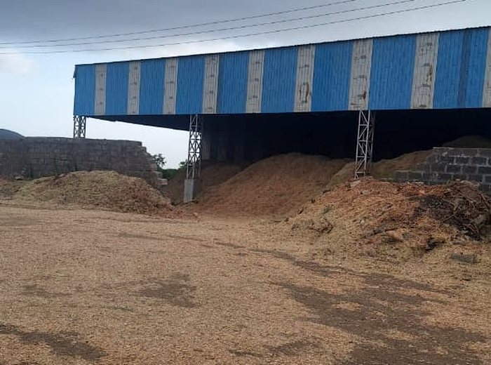 Agro residue spread across the open drying yard at the Biogreen Energy plant
